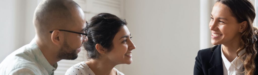 Advisor and couple having a discussion.